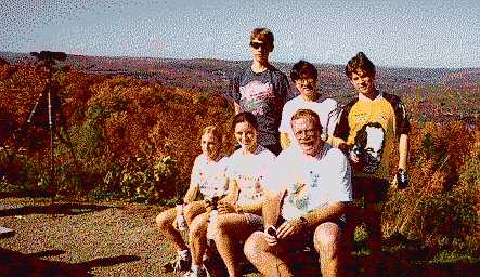 Image of cyclists taking a break atop Hawk Mountain.